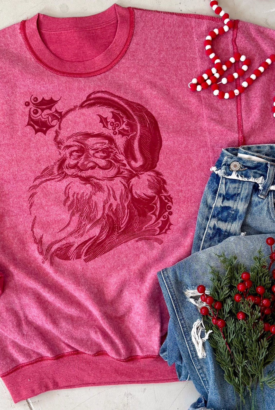 Heather red inside-out sweatshirt with vintage-inspired Santa face graphic