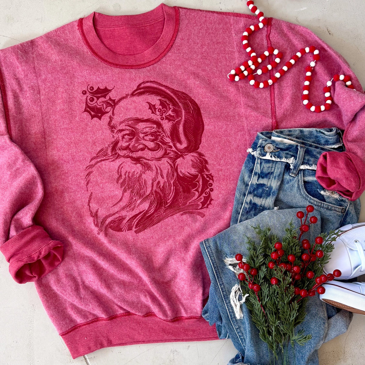 Heather red inside-out sweatshirt with vintage-inspired Santa face graphic
